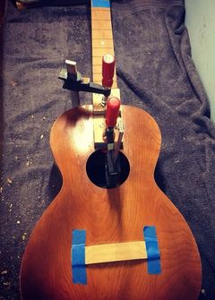 Guitar being repaired
