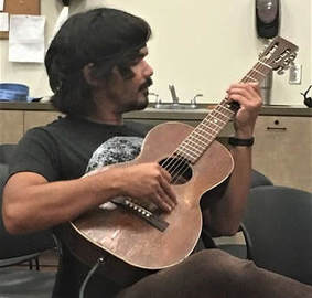 Lee Coulter Practices Guitar